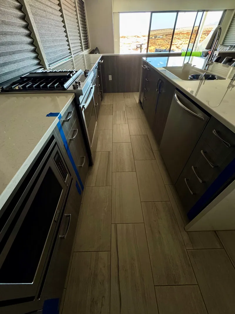 Slide: The Image of Modern kitchen interior in 2017 Adonia KSIX RV with sleek countertops and appliances. - 31