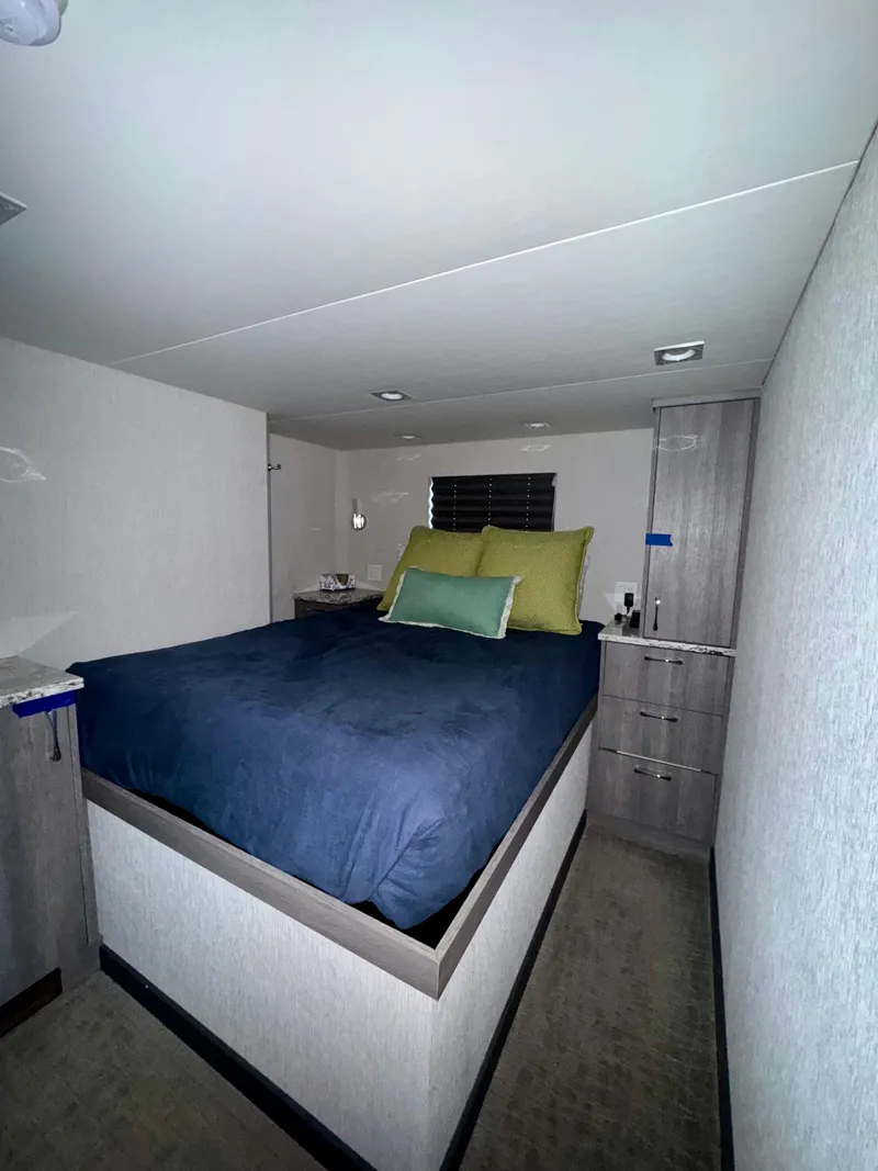 Slide: The Image of Interior of 2017 Adonia KSIX RV with cozy bed and modern decor. - 5