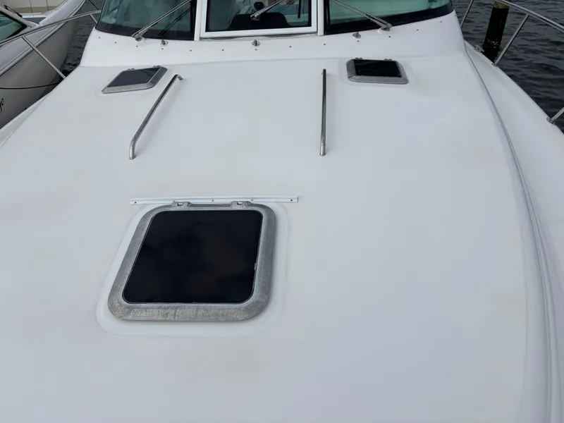 Slide: The Image of 2005 Tiara Yachts 3800 Open deck with hatches and railings. - 11