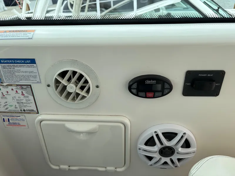 Slide: The Image of Control panel of a 2005 Tiara Yachts 3800 Open, featuring vents and audio controls. - 19