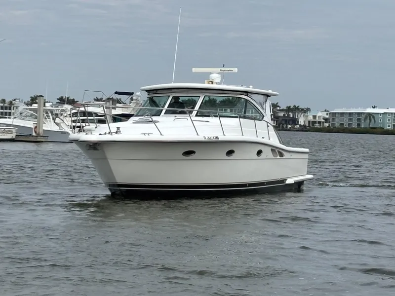 Slide: The Image of 2005 Tiara Yachts 3800 Open cruising on a calm waterway. - 2