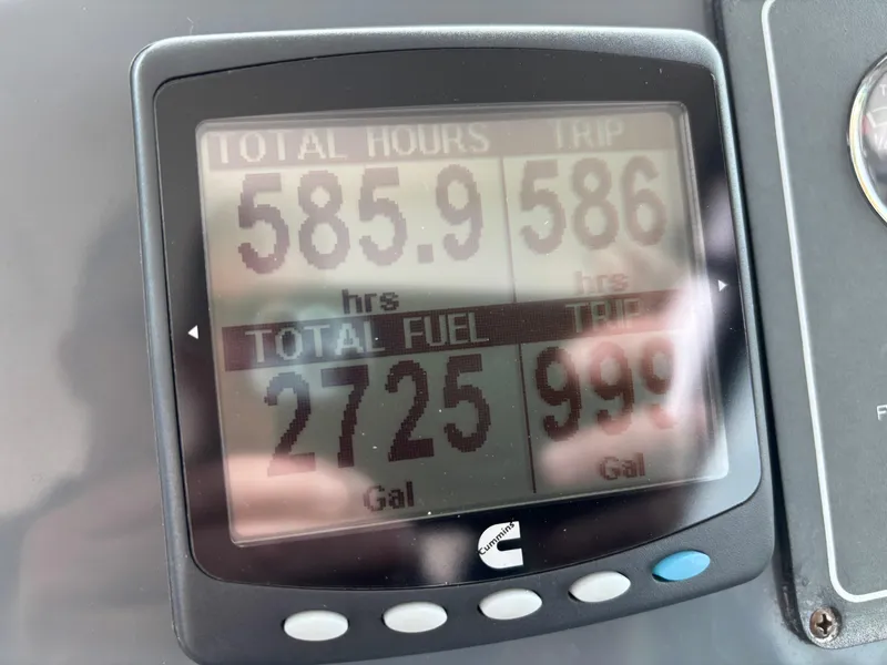 Slide: The Image of Display screen showing engine hours and fuel usage on a 2005 Tiara Yachts 3800 Open. - 24