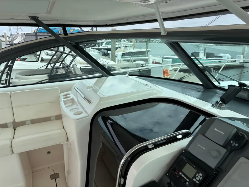 Slide: The Image of 2005 Tiara Yachts 3800 Open interior with helm and seating area. - 34