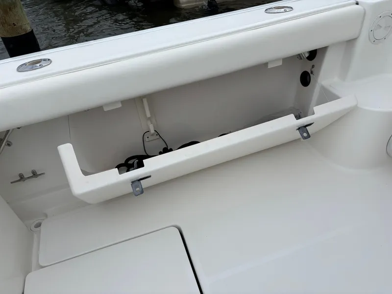 Slide: The Image of 2005 Tiara Yachts 3800 Open storage compartment with open hatch, showcasing interior details. - 39