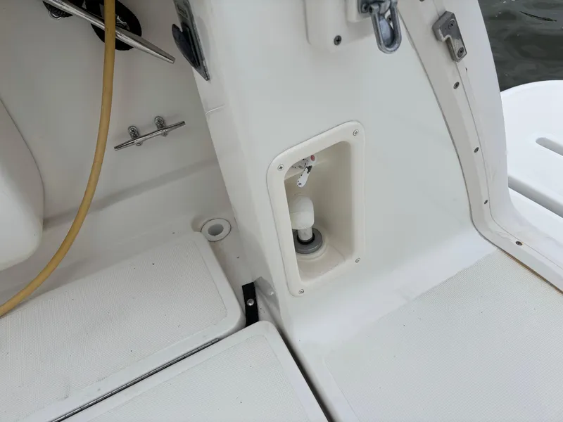 Slide: The Image of 2005 Tiara Yachts 3800 Open deck detail with hose connection and storage compartment. - 42