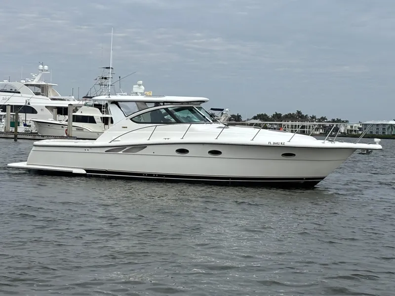 Slide: The Image of 2005 Tiara Yachts 3800 Open cruising on calm waters, side view. - 5
