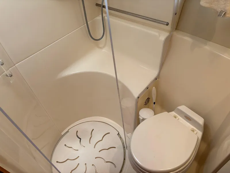 Slide: The Image of 2005 Tiara Yachts 3800 Open bathroom with shower and toilet. - 65