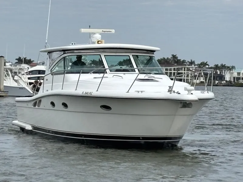 Slide: The Image of 2005 Tiara Yachts 3800 Open cruising on a calm waterway. - 7
