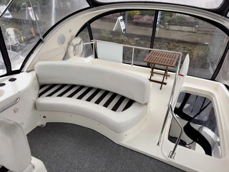 Slide: The Image of 2006 Meridian 411 Sedan interior with curved seating and small table. - 13