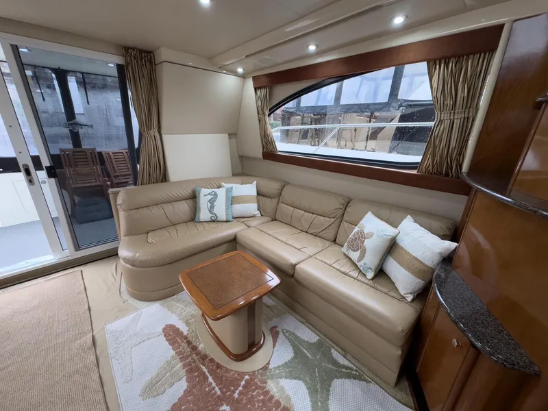 Slide: The Image of Luxurious interior of a 2006 Meridian 411 Sedan yacht with plush seating and elegant decor. - 15