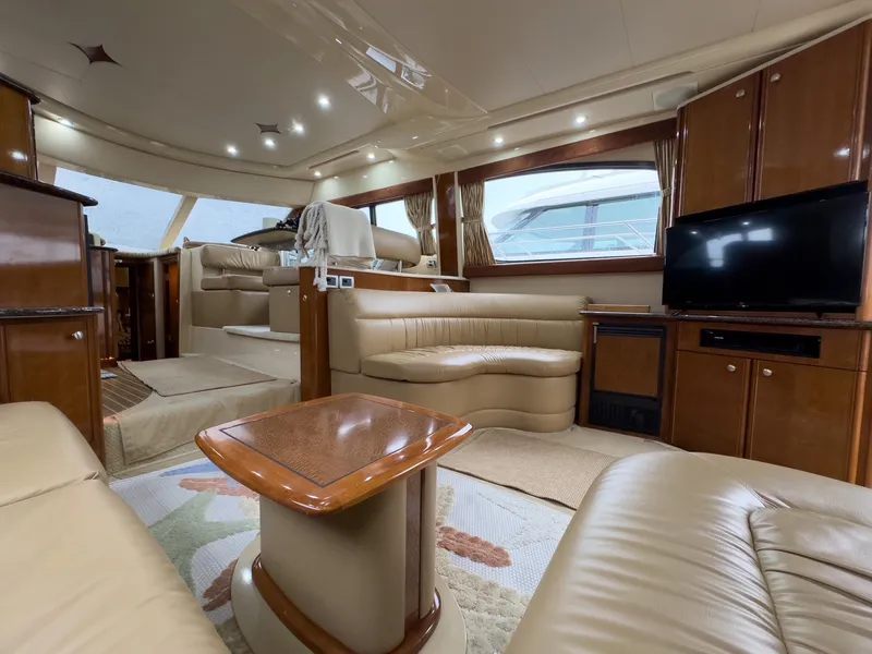 Slide: The Image of Luxurious interior of a 2006 Meridian 411 Sedan yacht with plush seating and modern amenities. - 16