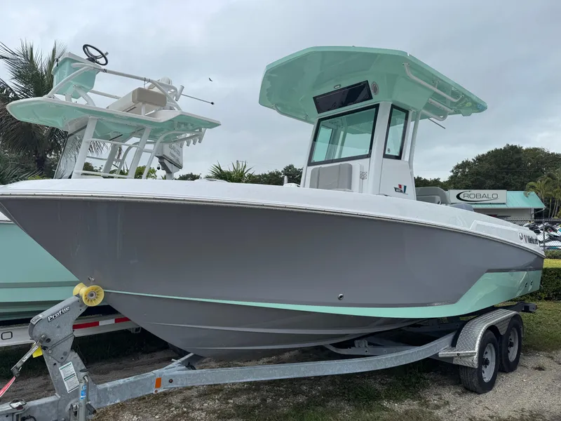 The Image of 2025 Wellcraft 223 Fisherman boat on trailer, featuring sleek design and modern amenities. - 1