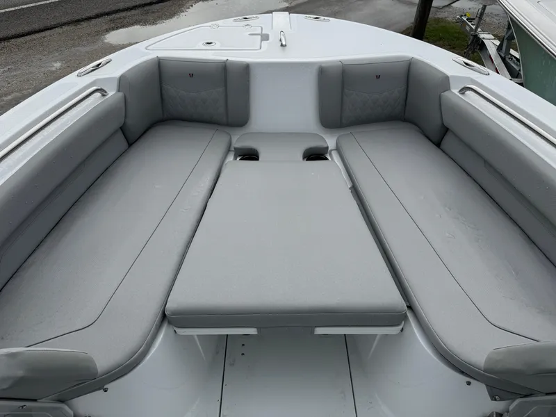 Slide: The Image of 2025 Wellcraft 223 Fisherman boat interior with gray cushioned seating. - 14