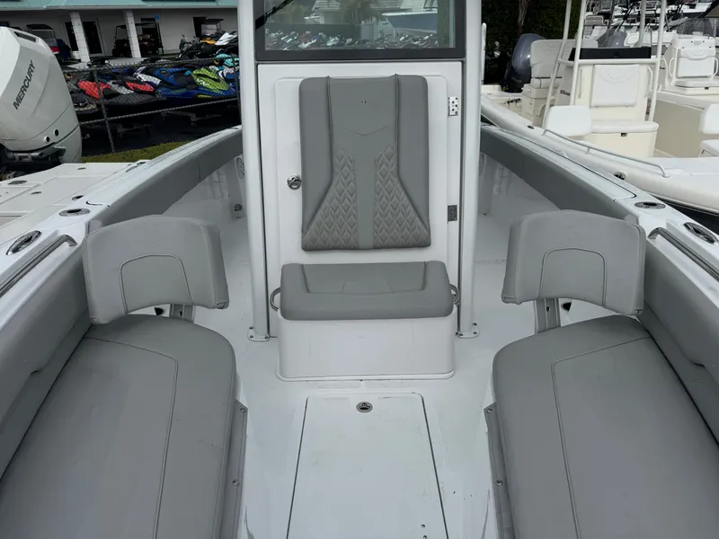 Slide: The Image of 2025 Wellcraft 223 Fisherman boat interior with gray seating and modern design. - 21