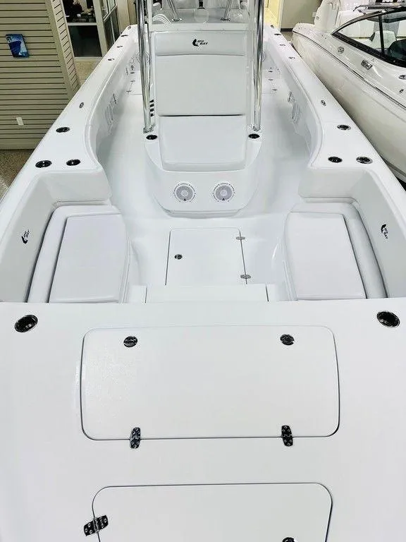 Slide: The Image of 2025 Contender 29BAY boat interior, featuring spacious white deck and storage compartments. - 10