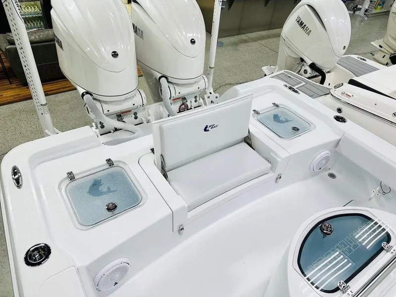 Slide: The Image of 2025 Contender 29BAY boat with Yamaha engines, featuring a spacious deck and seating area. - 13