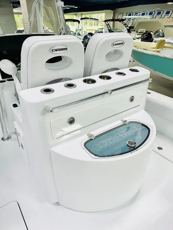 Slide: The Image of 2025 Contender 29BAY boat interior with seating and fishing rod holders. - 3