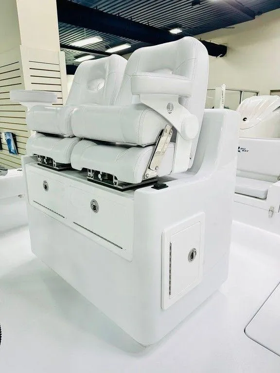 Slide: The Image of 2025 Contender 29BAY boat seating with white cushioned seats and storage compartments. - 4