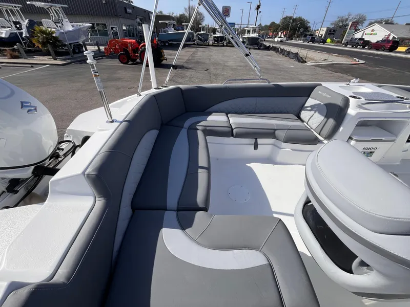 Slide: The Image of 2025 NauticStar 203 SC Deck boat with spacious seating and modern design. - 6