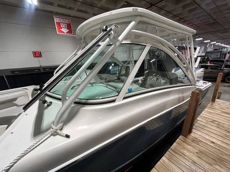 Slide: The Image of 2019 Albemarle 27 Dual Console boat displayed indoors, showcasing sleek design and modern features. - 12