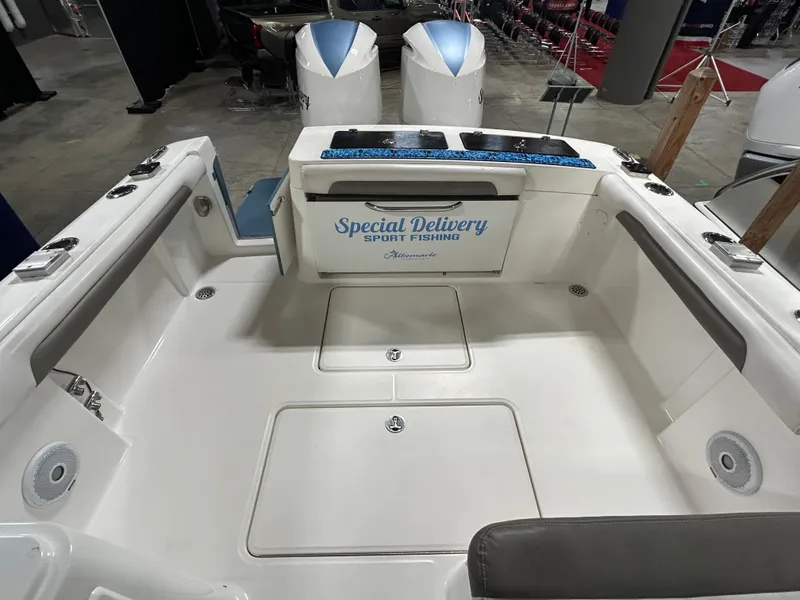 Slide: The Image of 2019 Albemarle 27 Dual Console boat interior with "Special Delivery Sport Fishing" sign. - 13