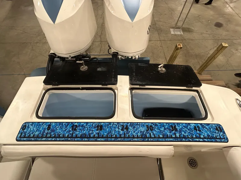Slide: The Image of 2019 Albemarle 27 Dual Console boat with dual engines and a blue measuring ruler. - 15