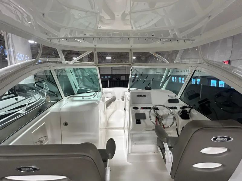 Slide: The Image of 2019 Albemarle 27 Dual Console boat interior with helm, seating, and modern design. - 20