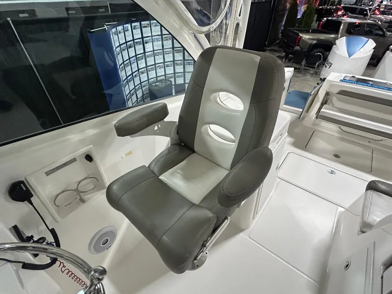 Slide: The Image of 2019 Albemarle 27 Dual Console boat interior with a comfortable captain's chair. - 21
