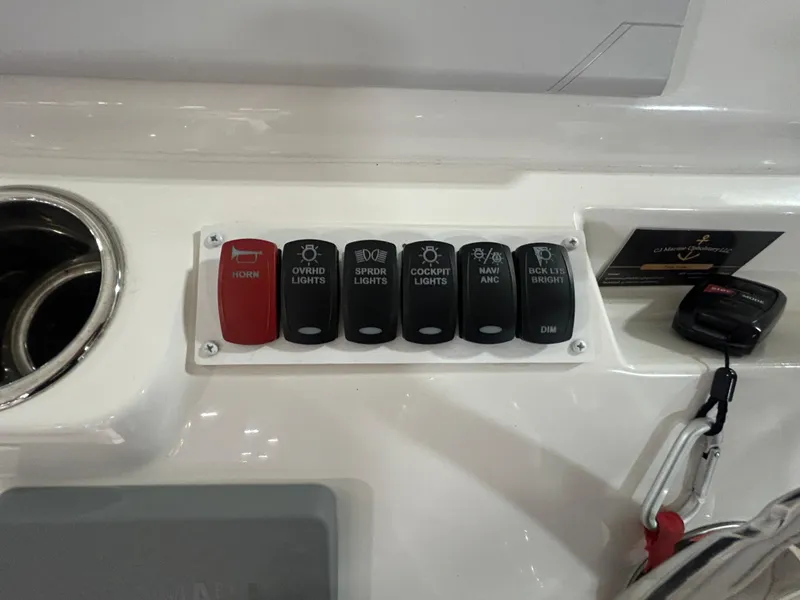 Slide: The Image of Control panel of 2019 Albemarle 27 Dual Console boat with labeled switches. - 24