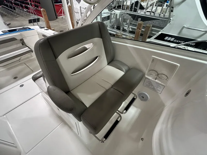 Slide: The Image of 2019 Albemarle 27 Dual Console boat interior with cushioned seating. - 27