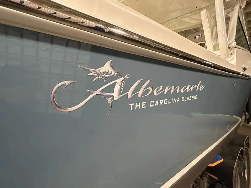Slide: The Image of 2019 Albemarle 27 Dual Console boat with "The Carolina Classic" logo on blue hull. - 3