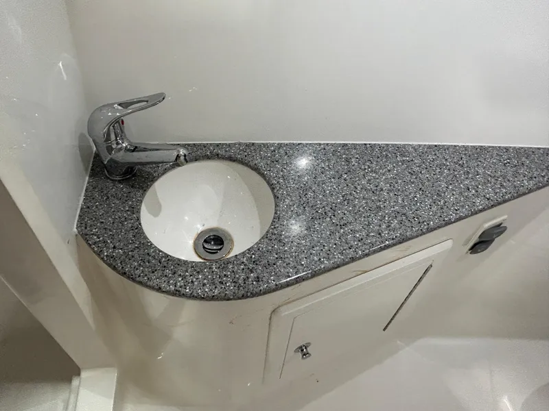 Slide: The Image of 2019 Albemarle 27 Dual Console boat bathroom sink with granite countertop. - 31