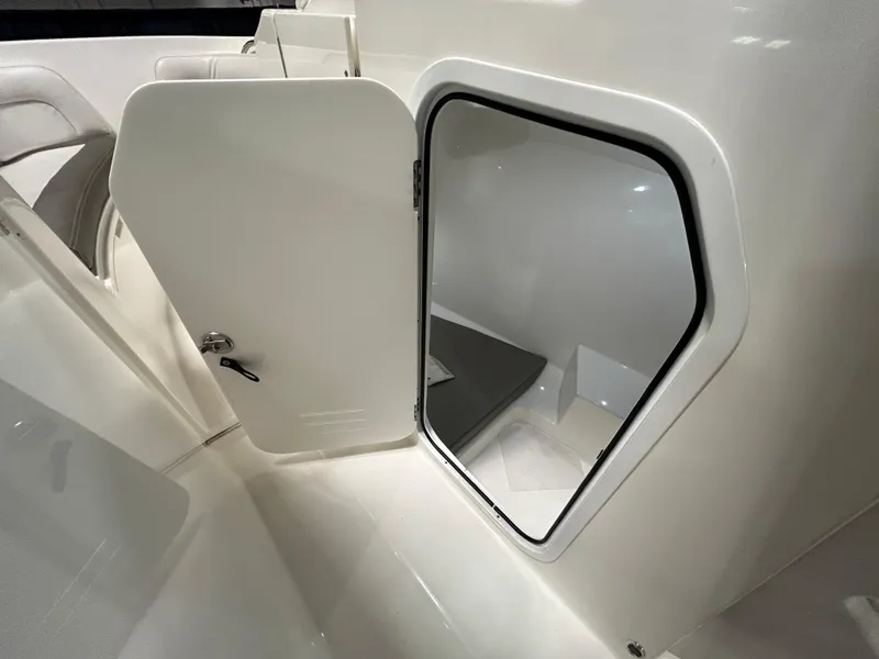 Slide: The Image of 2019 Albemarle 27 Dual Console boat interior storage compartment. - 32