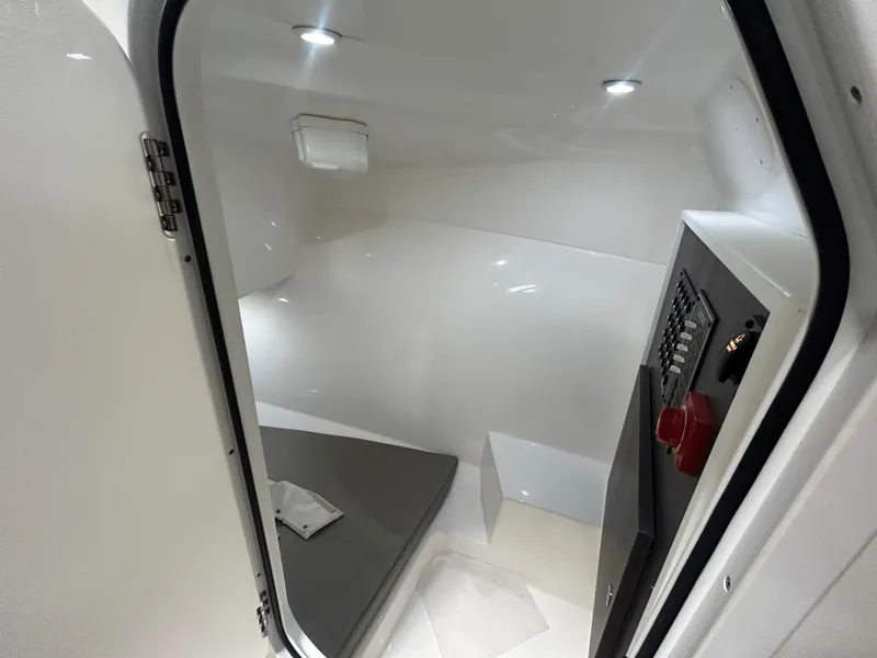 Slide: The Image of Interior cabin of 2019 Albemarle 27 Dual Console boat, featuring sleek design and modern amenities. - 33
