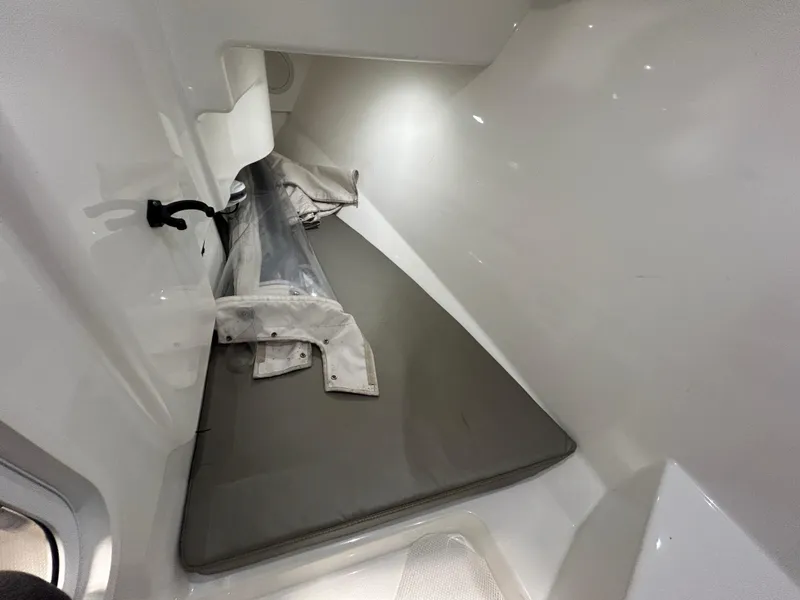 Slide: The Image of 2019 Albemarle 27 Dual Console interior cabin with cushions and storage. - 34