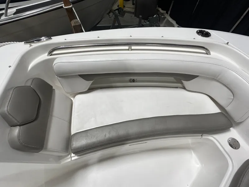 Slide: The Image of 2019 Albemarle 27 Dual Console boat interior with white and gray seating. - 38
