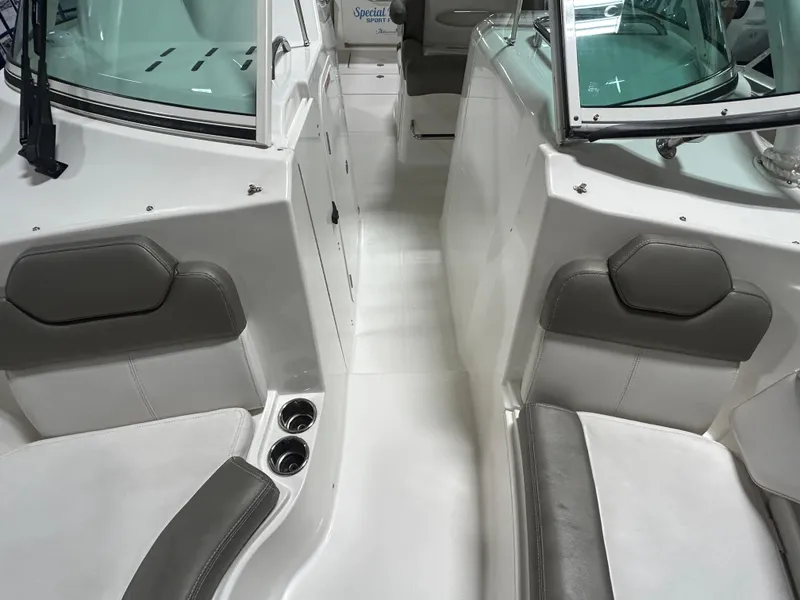 Slide: The Image of 2019 Albemarle 27 Dual Console interior with gray seating and cup holders. - 39