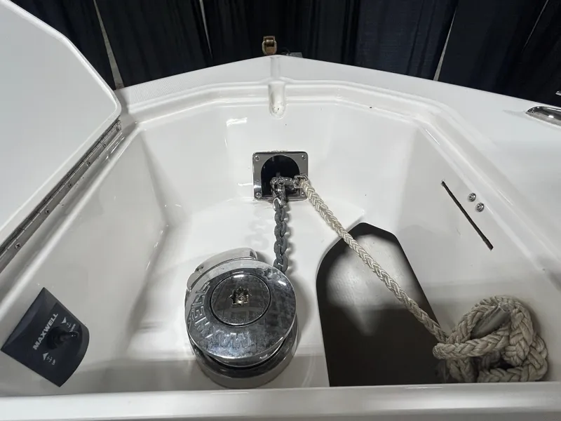 Slide: The Image of Anchor compartment of 2019 Albemarle 27 Dual Console boat with chain and rope. - 40