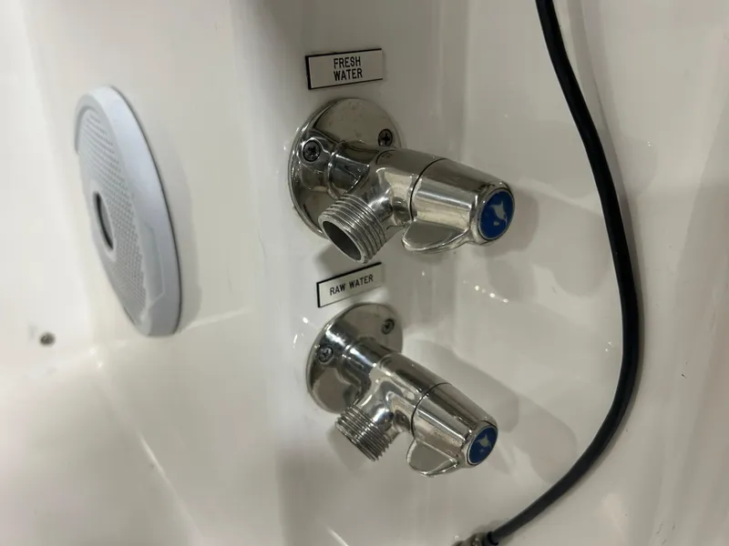 Slide: The Image of 2019 Albemarle 27 Dual Console water outlets for fresh and raw water. - 41