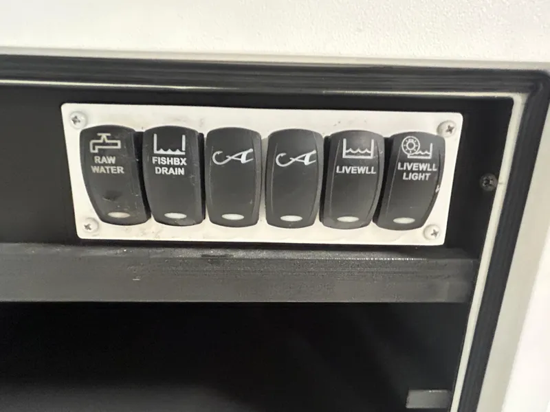 Slide: The Image of Control panel of a 2019 Albemarle 27 Dual Console boat with labeled switches. - 43