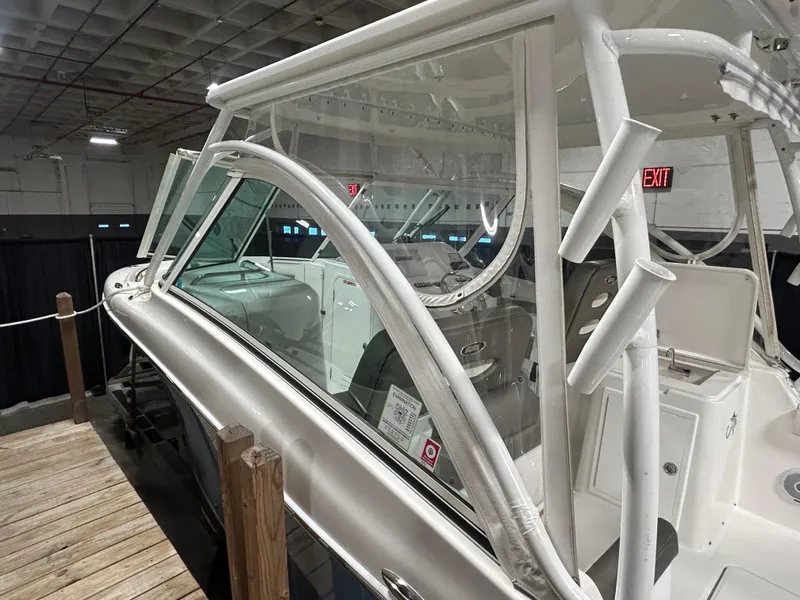 Slide: The Image of 2019 Albemarle 27 Dual Console boat in indoor showroom, side view. - 8