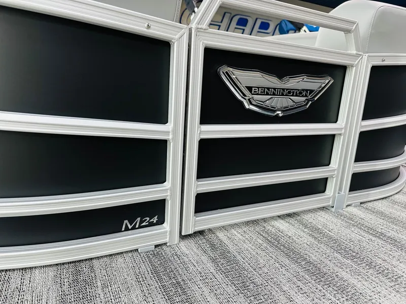 Slide: The Image of 2025 Bennington 24 MFB pontoon boat with sleek black and white design. - 10