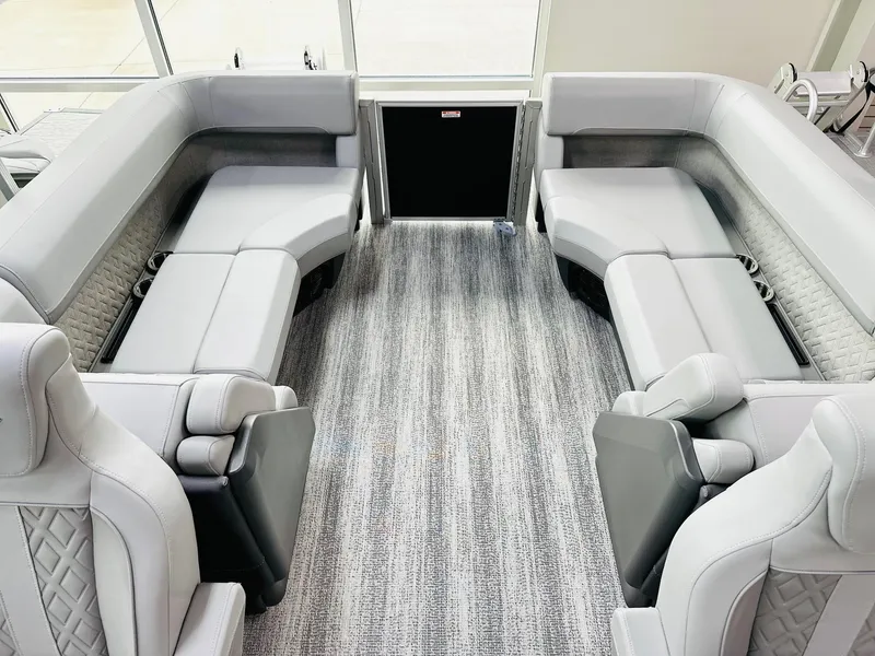 Slide: The Image of 2025 Bennington 24 MFB boat interior with luxurious gray seating and modern design. - 6