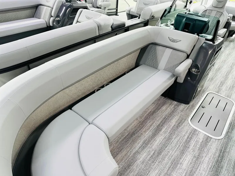 Slide: The Image of 2025 Bennington 24 MFB boat interior with luxurious seating and modern design. - 9