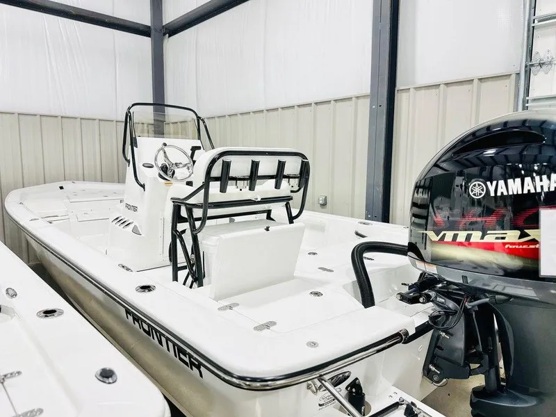The Image of 2025 Frontier 2104 boat with Yamaha engine in a storage facility. - 1