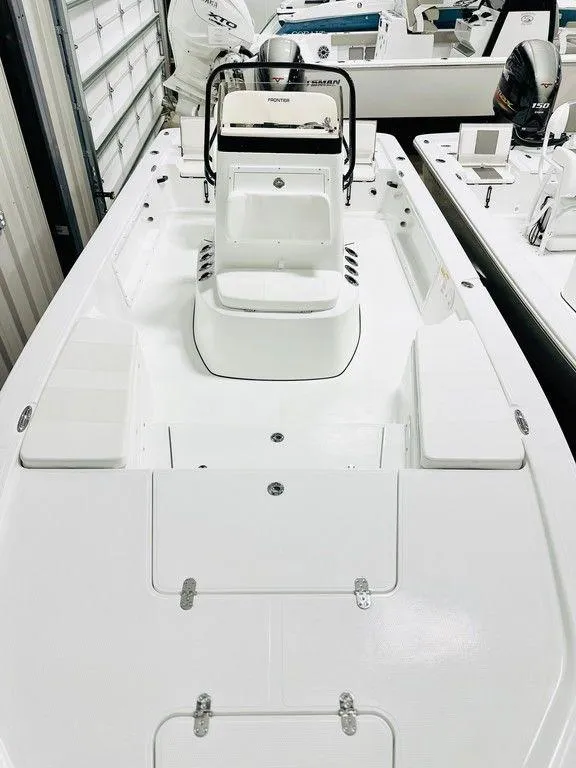 Slide: The Image of 2025 Frontier 2104 boat interior with sleek white design and modern console. - 4
