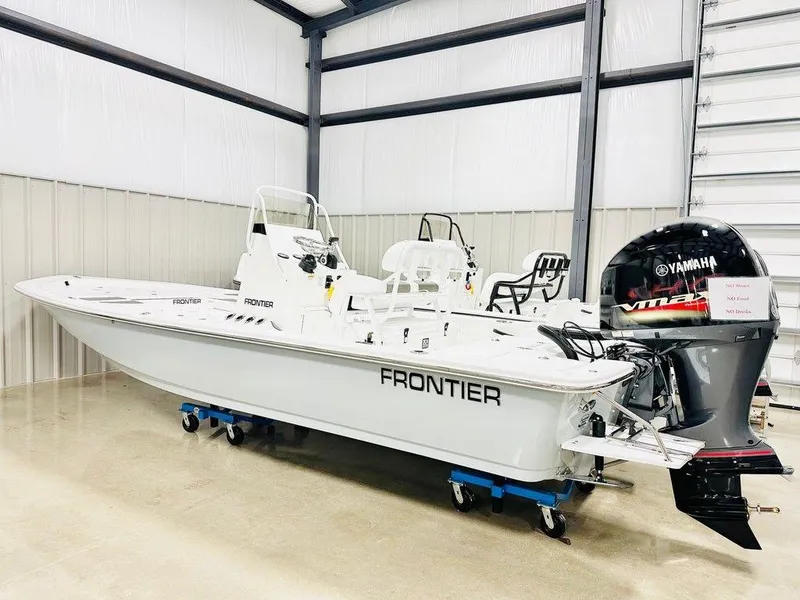 The Image of 2025 Frontier 2104 boat in a showroom, featuring a Yamaha outboard motor. - 0
