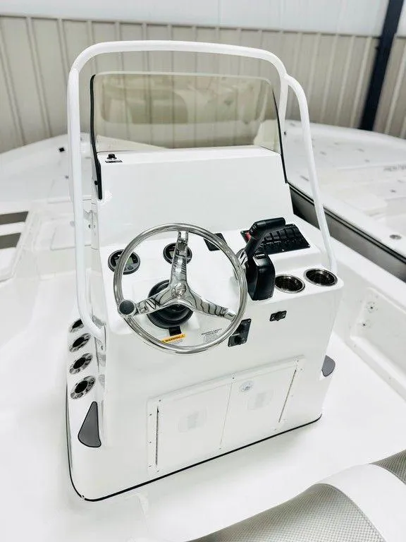 Slide: The Image of 2025 Frontier 2104 boat console with steering wheel and controls in a sleek, modern design. - 1