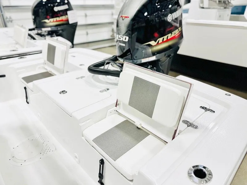 Slide: The Image of 2025 Frontier 2104 boat with Yamaha VMAX 150 engine, featuring open storage compartments. - 8
