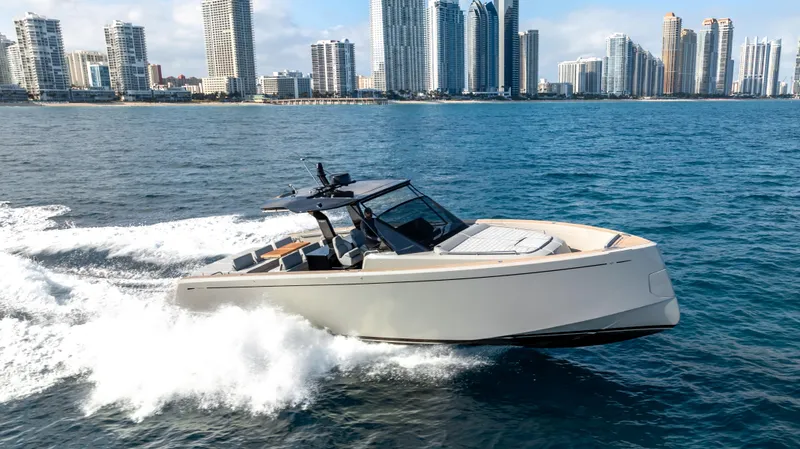 Slide: The Image of 2024 Pardo Yachts 43 cruising near city skyline, showcasing sleek design and luxury. - 11